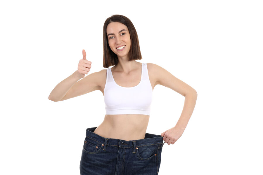 Woman celebrating weight loss results